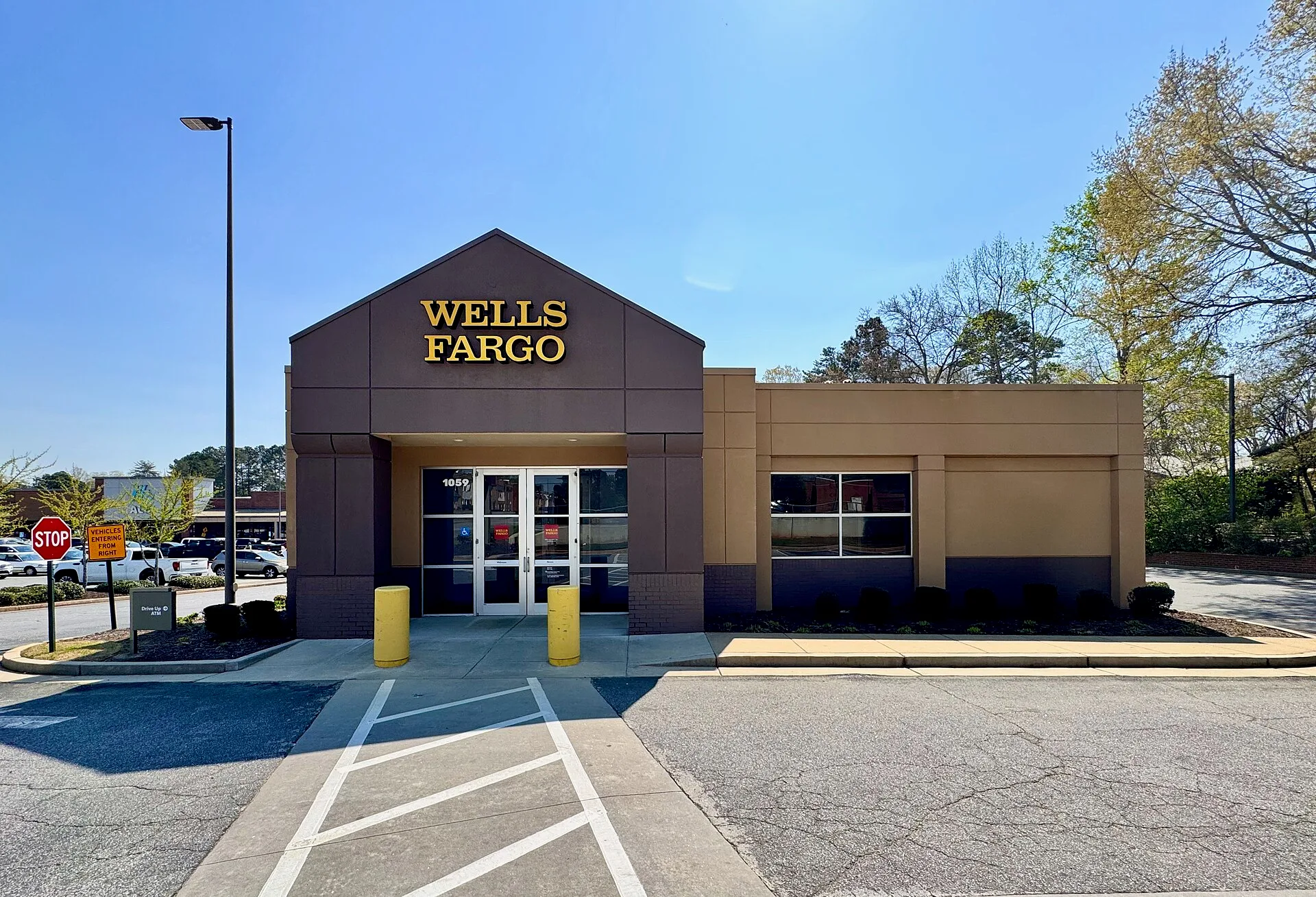 Exterior of a modern Wells Fargo bank branch in Athens, Georgia. How branch access shapes business banking costs in Toronto, Halifax and Whitehorse