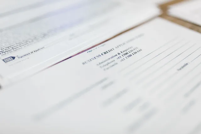 Focused image of business credit application papers, ideal for finance themes. How Quebec's caisses populaires open accounts differently from the Big Six